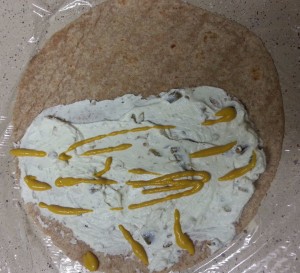 Add mustard to a low carb tortilla wrap